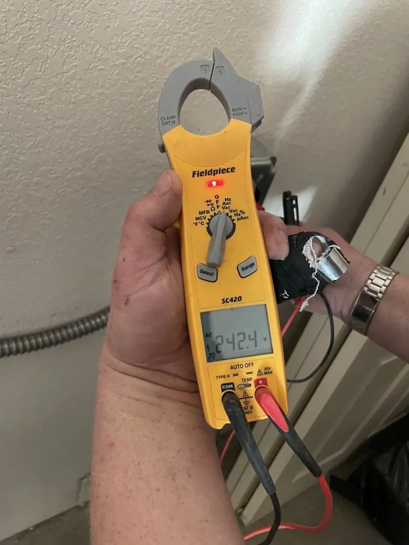 Voltage testing with clamp meter during Circuit Breaker Repair in Mashpee